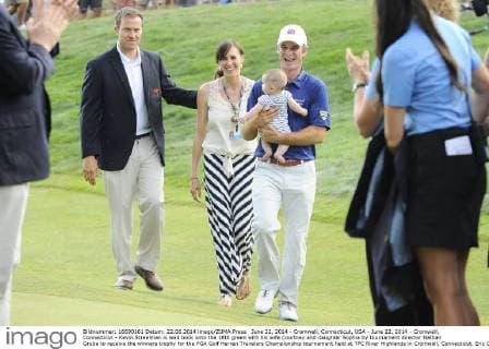 June 22, 2014 - Cromwell, Connecticut, USA - June 22, 2014 - Cromwell, Connecticut - Kevin Streelman is lead bock onto the 18th green with his wife Courtney and daughter Sophia by tournament director Nathan Grube to receive the winners trophy for the PGA Golf Herren Travelers Championship tournament held at TPC River Highlands in Cromwell, Connecticut. Eric Canha CSM PGA Golf Herren 2014: Travelers Championship JUN 22 - ZUMAc04