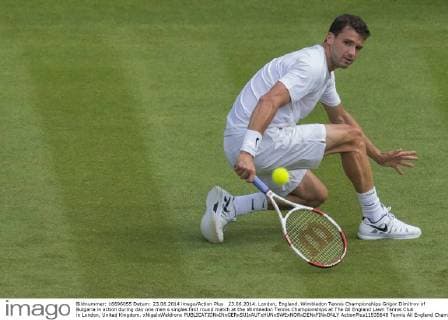23.06.2014. London, England. Wimbledon Tennis Championships Grigor Dimitrov of Bulgaria in action during day one men s singles first round match at the Wimbledon Tennis Championships at The All England Lawn Tennis Club in London, United Kingdom. xNigelxWaldronx  ActionPlus11535648