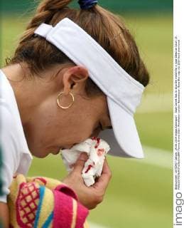 Alize Cornet has to stop the match for a nose bleed on Court 19. 