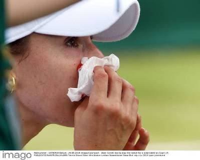 Alize Cornet has to stop the match for a nose bleed on Court 19. 