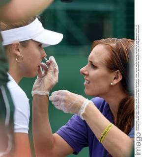 Alize Cornet has to stop the match for a nose bleed on Court 19. 
