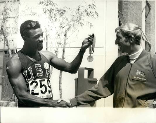 Oct. 10, 1968 - Olympic Games in Mexico. David Hemery Receives Congratulations from John Carlos on Winning Gold Meda. David Hemery (Great Britain), on right who won the Men s 400 Metres Hurdles Final at the Olympic Games - is shown being congratulated by John Carlos (U.S.A), who is admiring David s Gold Medal. It was announced today that Carlos. who received a bronze medal in the Men s 200 Metres event, and fellow American, Tommie Smith - who won the Gold in 200 Metres event - had been suspended and ordered to remove themselves from the Olympic Village because of the Black Power incident on Wednesday when they received their Olympic medals.  - ZUMAk09