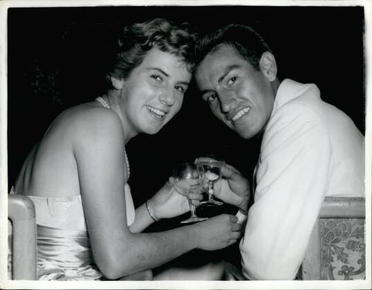 Jul. 07, 1959 - Champion Toast Champion. Photo Shows: Wimbledon men s and women s singles champions - Alex Olmedo, of Peru and Maria Bueno, of Brazil, drink a toast together at the Wimbledon Ball given by the Lawn Tennis Association at Grosvernor house Hotel, in London, last night. It is the first time that both the men s and ladies champion have come from South America. Olmedo represented the United States in the Wimbledon tournament.  - ZUMAk09
