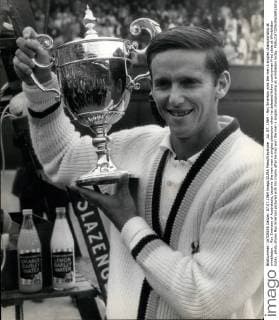 Jul. 07, 1964 - Roy Emerson wins the men s singles championship at wimbledon. : Roy Emerson of Australasia, became the new man s singles champion when he defeated fellow countryman Fred stole at Wimbledon today. photo shows Roy Emerson pictured with his trophy after he had won the men s singles championship at wimbledon today.  - ZUMAk09