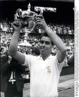 Jul. 07, 1966 - Tennis at Wimbledon. Santana wins Men s Singles final.: Photo shows Manuel Santana of Spain held the sup alert in ~~~~~ after his win over Dennis Ralston, of the United States in the Men s Singles Final at Wimbledon today, Santana won 6-4, 11-9, 6-4.  - ZUMAk09