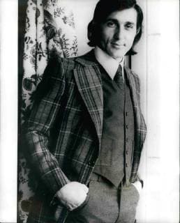 Feb. 28, 2012 - Nasty - The Model: Ilie Nastase, The Rumanian tennis star who is noted for showing off on the tennis court, is seen here showing off the fashions of the famous French tailor Guy Laroche, for the fourthcoming Autumn Winter. Ilie is seen here wearing a three-place flannel suit, the jacket Scottish style in yellow, green and orange design on plain grey, with the hand-sewn trousers and waistcoat in becoming pastel grey.  - ZUMAk09