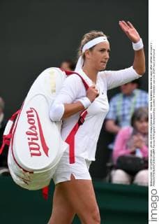 Victoria Azarenka leaves the court after defeat on Court 3 . 