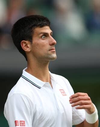 Novak Djokovic of Serbia reacts during the men s singles second round match at the 2014 Wimbledon Championships in Wimbledon, southwest London, Britain, on June 25, 2014. (Xinhua MengxYongmin) (hy) (SP) BRITAIN-LONDON-TENNIS-WIMBLEDON-DAY 3 
