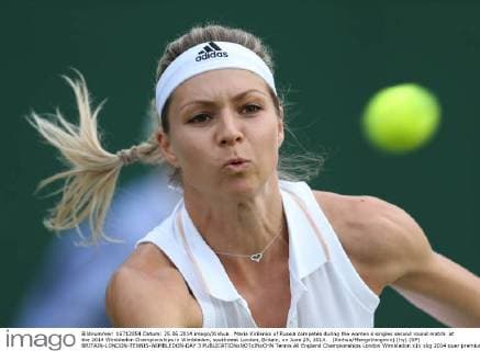 Maria Kirilenko of Russia competes during the women s singles second round match at the 2014 Wimbledon Championships in Wimbledon, southwest London, Britain, on June 25, 2014. (Xinhua MengxYongmin) (hy) (SP) BRITAIN-LONDON-TENNIS-WIMBLEDON-DAY 3 