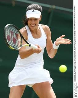 Serbia s Ana Ivanovic returns the ball during the women s singles second round match 