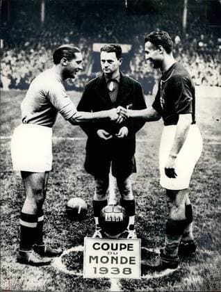 Jun. 06, 1938 - World Cup 1938: Start of the match Italy V Hungary which finished 4-2. On left is Italian player Giuseppe Meazza (the most famous of all Italian football - players.) On right Hungarian team captain György Sarosi. In centre French referree Georges Capdeville.  - ZUMAk09