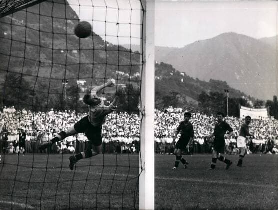 Jun. 20, 1954 - Football World Championships In Switzerland - Italy - Belgium: Leopold Gernay, the Belgium goal-keeper, treis to get the ball shot by the Italian Center-forward. Background shows a the Beautiful Lugano Mountains.  - ZUMAk09