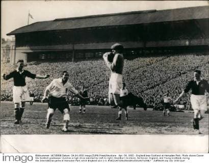 Apr. 04, 1950 - England bear Scotland at Hampden Park: Photo shows Cowan the Scottish goalkeeper clutches a high drive watched by (left to right) Woodburn Scotland, Nortenson England, and Young Scotland, during the International game at Hampden Park which England won 1-0.  - ZUMAk09
