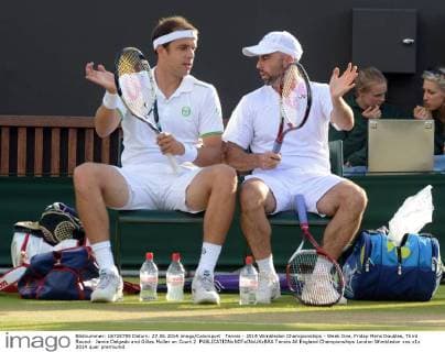 Tennis - 2014 Wimbledon Championships - Week One, Friday Mens Doubles, Third Round: Jamie Delgado and Gilles Muller on Court 2 