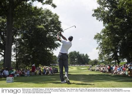 Tiger Woods hits off of the 7th tee during the second round of the Quicken Loans Nationals at Congressional Country Club, in Potomac, Maryland on June 27, 2014.  WAP20140627303