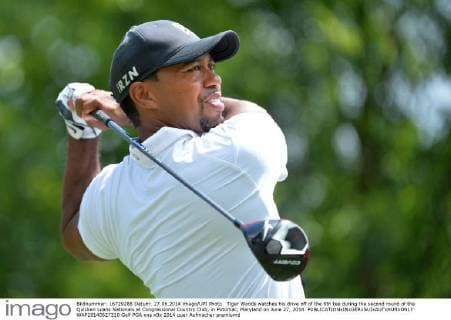 Tiger Woods watches his drive off of the 8th tee during the second round of the Quicken Loans Nationals at Congressional Country Club, in Potomac, Maryland on June 27, 2014.  WAP20140627310