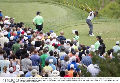 Tiger Woods hits off of the 10th tee during the second round of the Quicken Loans Nationals at Congressional Country Club, in Potomac, Maryland on June 27, 2014.  WAP20140627301