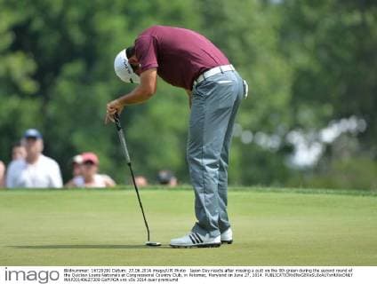 Jason Day reacts after missing a putt on the 9th green during the second round of the Quicken Loans Nationals at Congressional Country Club, in Potomac, Maryland on June 27, 2014.  WAP20140627309