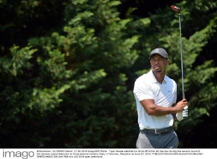 Tiger Woods watches his drive off of the 5th tee box during the second round of the Quicken Loans Nationals at Congressional Country Club, in Potomac, Maryland on June 27, 2014.  WAP20140627314