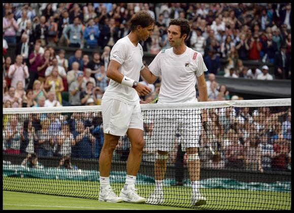 28 06 2014. London, United Kingdom. Rafael Nadal and Mikhail Kukushkin on centre court on Day 6 of the Wimbledon Championship. AndrewxParsonsx xi-Images  IIM-2544-0025