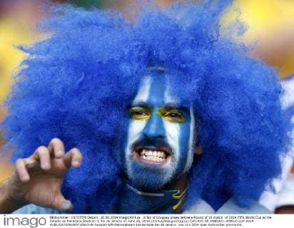 A fan of Uruguay poses before a Round of 16 match of 2014 FIFA World Cup at the Estadio do Maracana Stadium in Rio de Janeiro on June 28, 2014.(Xinhua WangxLili)(pcy) (SP) RIO DE JANEIRO -WORLD CUP 2014 