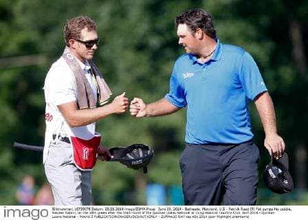 June 28, 2014 - Bethesda, Maryland, U.S - Patrick Reed (R) fist pumps his caddie, Kessler Karain, on the 18th green after the third round of the Quicken Loans National at Congressional Country Club. Golf 2014 - Quicken Loans National - Round 3 - ZUMAw10