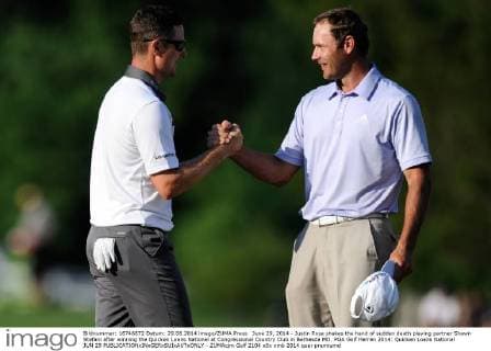 June 29, 2014 - Justin Rose shakes the hand of sudden death playing partner Shawn Stefani after winning the Quicken Loans National at Congressional Country Club in Bethesda MD. PGA Golf Herren 2014: Quicken Loans National JUN 29 - ZUMAcjm