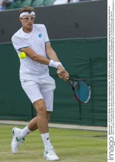 30.06.2014. London, England. Wimbledon Championships Day Seven Denis Istomin of Uzbekistan in action during day seven men s singles third round match at the Wimbledon Tennis Championships at The All England Lawn Tennis Club in London, United Kingdom xNigelxWaldronx  ActionPlus20207089