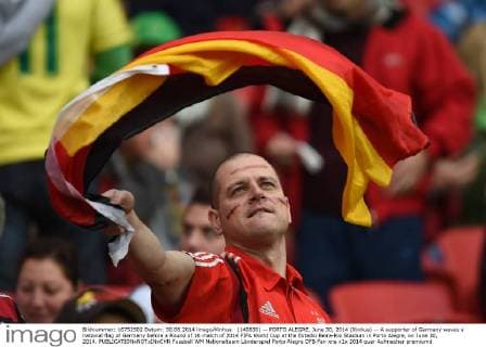 (140630) -- PORTO ALEGRE, June 30, 2014 (Xinhua) -- A supporter of Germany waves a national flag of Germany before a Round of 16 match of 2014 FIFA World Cup at the Estadio Beira-Rio Stadium in Porto Alegre, on June 30, 2014. 