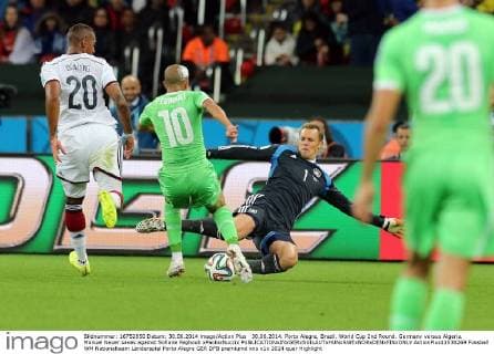 30.06.2014. Porto Alegre, Brazil. World Cup 2nd Round. Germany versus Algeria. Manuel Neuer saves against Sofiane Feghouli xPaoloxNuccix  ActionPlus11538269