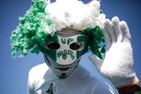(140630) -- BRASILIA, June 30, 2014 (Xinhua) -- A Nigeria s fan is seen outside the Estadio Nacional Stadium in Brasilia, on June 30, 2014, ahead of a Round of 16 match of 2014 FIFA World Cup. (Xinhua Jhon Paz)(jp) (SP)BRASILIA-WORD CUP 2014-FANS 