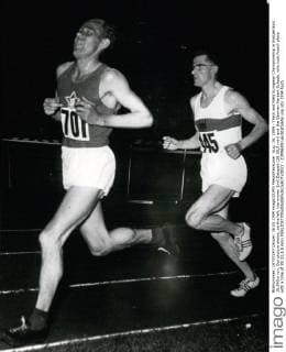 Aug. 26, 1954 - Track and Field European Championship in Switzerland. 10,000m run. Our picture shows, on the left, the winner Emil Zatopek (28:58,0 min) and the German Herbert Schade, who took fourth place with a time of 29:32,8,5 min)  - ZUMAk09