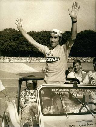 Jul. 19, 1971 - After winning the Tour de France a third time, Eddy Merckx, waves to the crowd who came to cheer him on at the Velodrame de Vincennes. His wife is by his side.  - ZUMAk09