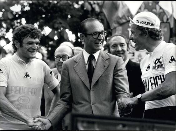 Jul. 25, 1977 - Chirac is congratulating the Tour de France winners at a podium on the Champs-Elysees.  - ZUMAk09