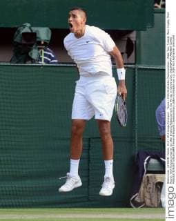 Tennis - 2014 Wimbledon Championships - Week Two, Tuesday Mens Singles, Third Round: Nick Kyrgios jumps for joy after breaking Nadals serve in the 4th set on Centre Court. COLORSPORT ANDREW COWIE 
