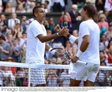 Tennis - 2014 Wimbledon Championships - Week Two, Tuesday Mens Singles, Third Round: Nick Kyrgios is congratulated by Rafael Nadal at the net after the match on Centre Court. COLORSPORT ANDREW COWIE 