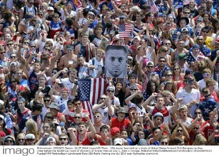 USA soccer fans hold up a photo of United States forward Clint Dempsey as they cheer before the World Cup round of 16 match at Soldier Field on July 1, 2014 in Chicago.  CHI2014070103