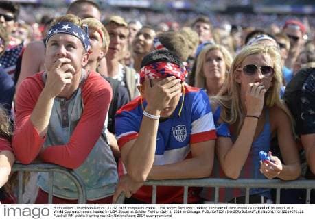 USA soccer fans react during overtime of their World Cup round of 16 match at a World Cup watch event hosted by USA Soccer at Soldier Field on July 1, 2014 in Chicago.  CHI2014070128