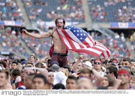 A USA soccer fan cheers during the overtime period of the World Cup round of 16 match at Soldier Field on July 1, 2014 in Chicago.  CHI2014070135