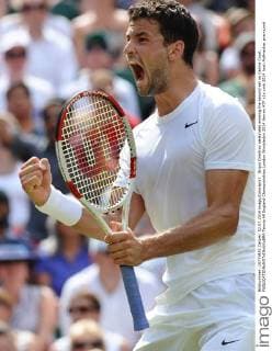 Grigor Dimitrov celebrates winning the second set on Centre Court. 
