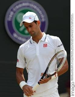 Serbia s Novak Djokovic reacts during the men s singles quarter final 