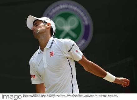 Serbia s Novak Djokovic reacts during the men s singles quarter final 