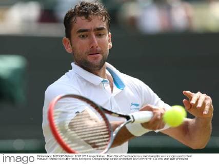 Marin Cilic of Croatia returns a shot during the men s singles quarter final 