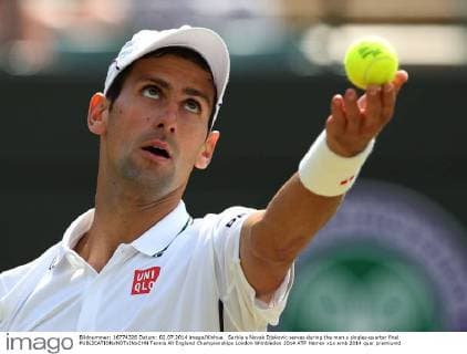 Serbia s Novak Djokovic serves during the men s singles quarter final 