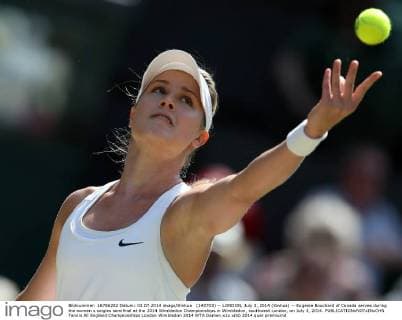 (140703) -- LONDON, July 3, 2014 (Xinhua) -- Eugenie Bouchard of Canada serves during the women s singles semifinal at the 2014 Wimbledon Championships in Wimbledon, southwest London, on July 3, 2014. 