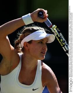 (140703) -- LONDON, July 3, 2014 (Xinhua) -- Eugenie Bouchard of Canada returns a shot during the women s singles semifinal at the 2014 Wimbledon Championships in Wimbledon, southwest London, on July 3, 2014. 