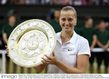 (140705) -- LONDON, July 5, 2014 (Xinhua) -- Czech Republic s Petra Kvitova poses with the trophy during the award ceremony after the women s singles final match at the 2014 Wimbledon Championships in Wimbledon, southwest London, on July 5, 2014. (Xinhua Meng Yongmin) (FOCUS) (SP)BRITAIN-LONDON-TENNIS-WIMBLEDON-WOMEN S SINGLES FINAL 