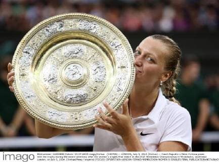 (140705) -- LONDON, July 5, 2014 (Xinhua) -- Czech Republic s Petra Kvitova poses with the trophy during the award ceremony after the women s singles final match at the 2014 Wimbledon Championships in Wimbledon, southwest London, on July 5, 2014. (Xinhua Meng Yongmin) (FOCUS) (SP)BRITAIN-LONDON-TENNIS-WIMBLEDON-WOMEN S SINGLES FINAL 