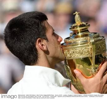 July 6, 2014 - London, England, United Kingdom - NOVAK DJOKOVIC kisses the trophy after winning the Wimbledon Men s Final. Tennis 2014 - Wimbledon - Djokovic Wins  - ZUMAap2