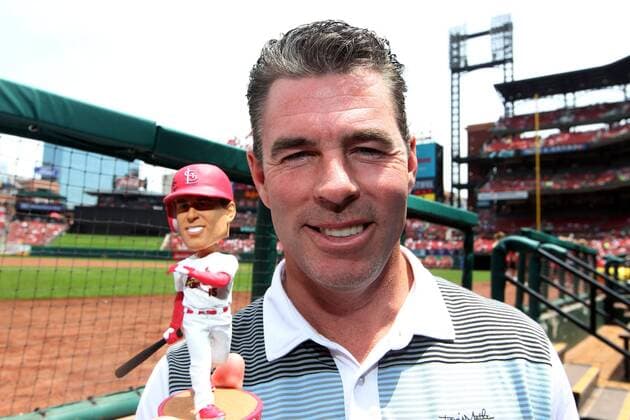 Former St. Louis Cardinals centerfielder Jim Edmonds shows off the Jim Edmonds bobblehead being given away to all those in attendence on Jim Edmonds Day before the Miami Marlins-St. Louis Cardinals baseball game, at Busch Stadium in St. Louis on July 6, 2014.  SLP2014070604